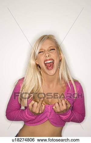 Portrait of sassy attractive blonde Caucasian young adult woman wearing fuchsia making bold hand gestures at viewer. View Large Photo Image Stock Photograph - Portrait of sassy attractive blonde Caucasian young adult woman wearing fuchsia making bold hand gestures at viewer.. Fotosearch