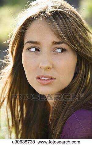 Close-up portrait of attractive young Caucasian woman with long brown hair. View Large Photo Image Stock Photo - Close-up portrait of attractive young Caucasian woman with long brown hair.. Fotosearch