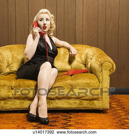 Attractive Caucasian woman talking on red retro phone. View Large Photo Image Stock Image - Attractive Caucasian woman talking on red retro phone. . Fotosearch