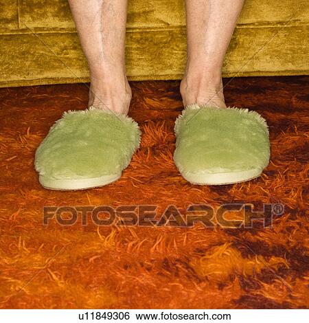 Caucasian senior female feet wearing green bedroom slippers on carpet. View Large Photo Image Stock Photograph - Caucasian senior female feet wearing green bedroom slippers on carpet.. Fotosearch