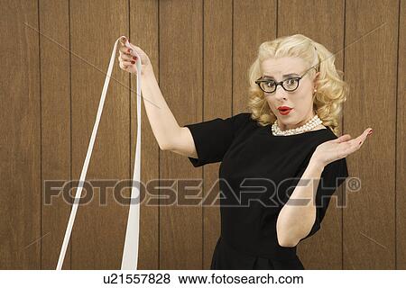 Stock Photo - Female in vintage outfit holding a printout. Fotosearch