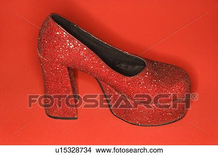 Red glitter high heel shoe against red background. View Large Photo Image Picture - Red glitter high heel shoe against red background.. Fotosearch