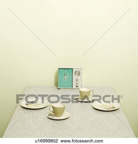 Retro 50's table setting with dishes coffee cups and vintage clock radio. View Large Photo Image Stock Image - Retro 50's table setting with dishes coffee cups and vintage clock radio.. Fotosearch