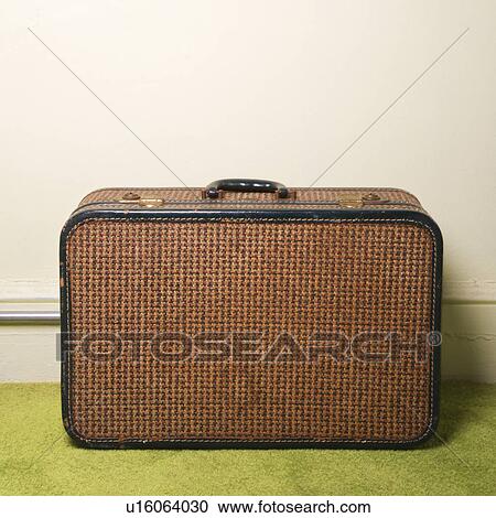 Still life of brown retro suitcase on green carpet. View Large Photo Image Stock Image - Still life of brown retro suitcase on green carpet.. Fotosearch