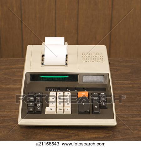 Still life shot of a vintage calculator sitting on a wooden desk View Large Photo Image Stock Image - Still life shot of a vintage calculator sitting on a wooden desk. Fotosearch