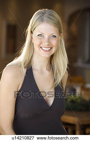 Caucasian mid adult woman smiling at viewer. View Large Photo Image Stock Photo - Caucasian mid adult woman smiling at viewer.. Fotosearch