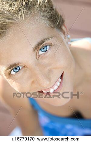 Close-up of Caucasian mid-adult woman smiling and looking at viewer. View Large Photo Image Stock Image - Close-up of Caucasian mid-adult woman smiling and looking at viewer.. Fotosearch