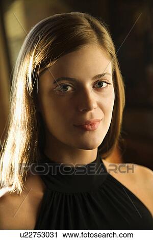Close-up portrait of smiling young woman View Large Photo Image Stock Image - Close-up portrait of smiling young woman. Fotosearch