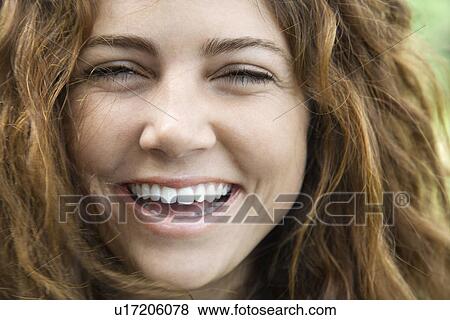 Female smiling and looking View Large Photo Image Stock Photo - Female smiling and looking. Fotosearch
