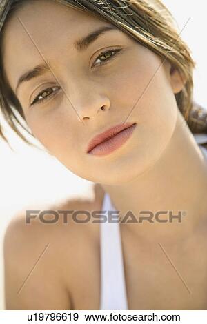 Stock Photo - Woman looking at viewer. Fotosearch