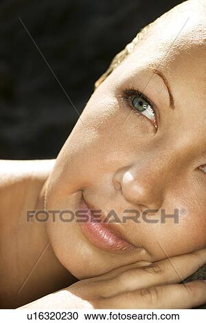 Woman's face with slick wet hair View Large Photo Image Stock Image - Woman's face with slick wet hair. Fotosearch