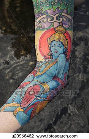 Arm of tattooed Caucasian woman by tidal pool View Large Photo Image Stock Image - Arm of tattooed Caucasian woman by tidal pool . Fotosearch