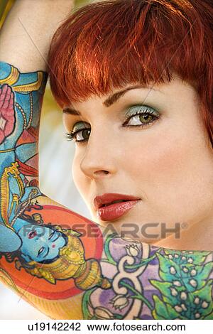 Close up portrait of attractive tattooed woman View Large Photo Image Stock Image - Close up portrait of attractive tattooed woman . Fotosearch