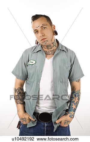 Stock Image - Man with tattoos and piercings. Fotosearch