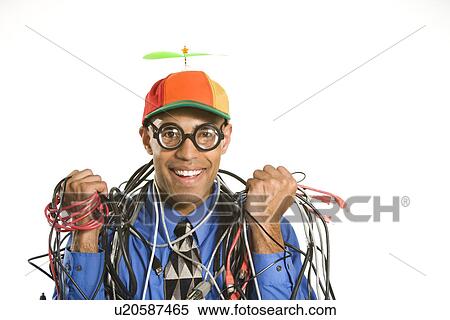 Businessman in silly hat holding tangled cords View Large Photo Image Stock Photography - Businessman in silly hat holding tangled cords. Fotosearch