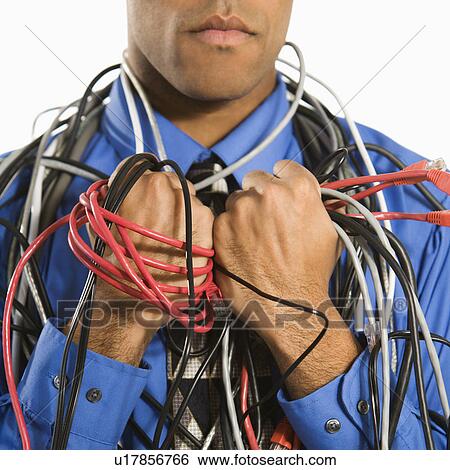 Close-up of a businessman's hands wrapped in electronics cords View Large Photo Image Stock Photograph - Close-up of a businessman's hands wrapped in electronics cords. Fotosearch