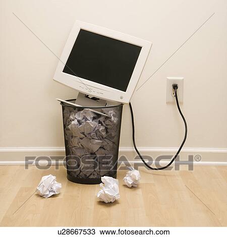 Computer monitor in trash can surrounded by crumpled up paper View Large Photo Image Stock Image - Computer monitor in trash can surrounded by crumpled up paper. Fotosearch