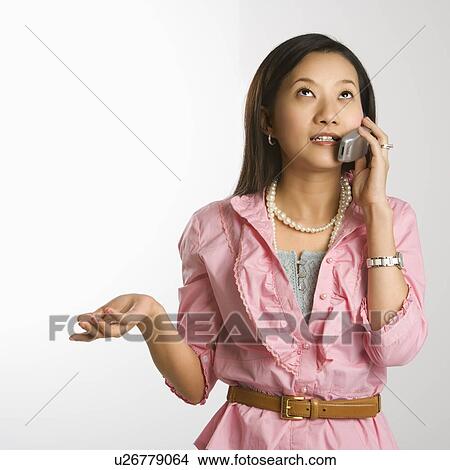 Woman on a cellphone View Large Photo Image Picture - Woman on a cellphone. Fotosearch