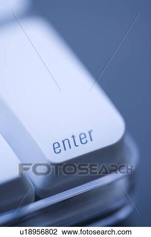 Stock Image - Close up of enter key on computer keyboard. Fotosearch