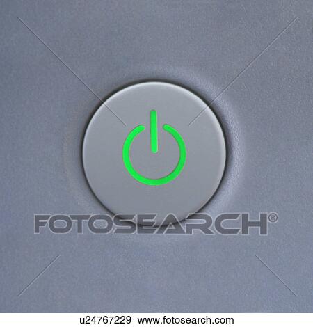 Stock Photo - Close up of power symbol on power button on computer. Fotosearch