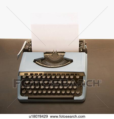 Stock Photo - Still life of blank sheet of paper in an old fashioned typewriter. Fotosearch