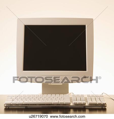 Stock Image - Still life of computer monitor and keyboard. Fotosearch