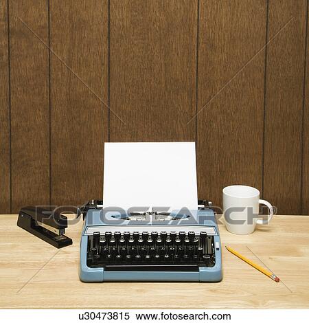 Vintage typewriter, coffee cup, pencil and stapler on desk. View Large Photo Image Stock Photography - Vintage typewriter, coffee cup, pencil and stapler on desk.. Fotosearch