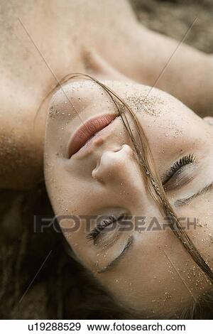 Head shot of pretty young adult woman with eyes closed View Large Photo Image Stock Photo - Head shot of pretty young adult woman with eyes closed. Fotosearch