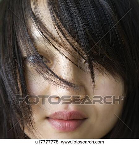 Stock Photo - Close up portrait of pretty young woman. Fotosearch