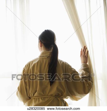 Taiwanese mid adult woman in bathrobe looking out window. View Large Photo Image Stock Photography - Taiwanese mid adult woman in bathrobe looking out window.. Fotosearch