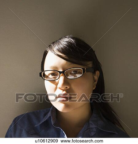 Woman wearing eyeglasses View Large Photo Image Stock Photo - Woman wearing eyeglasses. Fotosearch