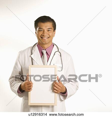 Picture - Doctor holding blank sign. Fotosearch
