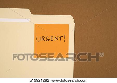 Folder with an orange sticky note attached reading urgent on brown background View Large Photo Image Stock Image - Folder with an orange sticky note attached reading urgent on brown background. Fotosearch