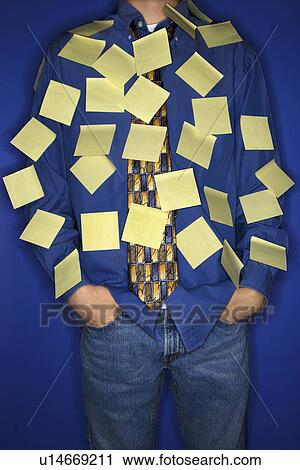 Stock Image - Portrait of boy covered with sticky notes. Fotosearch
