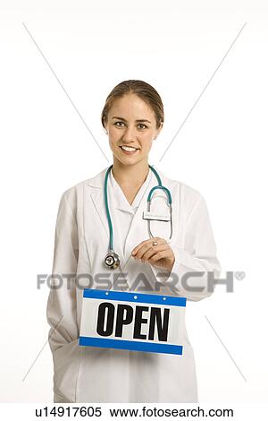 Portrait of doctor holding up open sign View Large Photo Image Stock Photography - Portrait of doctor holding up open sign. Fotosearch