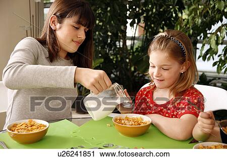 Children eating breakfast View Large Photo Image Stock Image - Children eating breakfast. Fotosearch