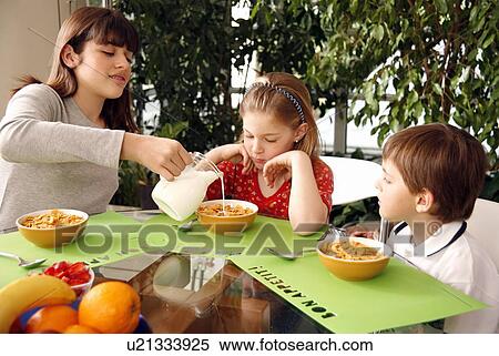 Children eating breakfast View Large Photo Image Stock Photography - Children eating breakfast. Fotosearch