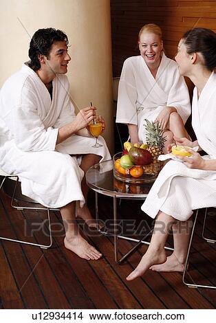 Friends having a refreshment after a spa treatment View Large Photo Image Picture - Friends having a refreshment after a spa treatment. Fotosearch