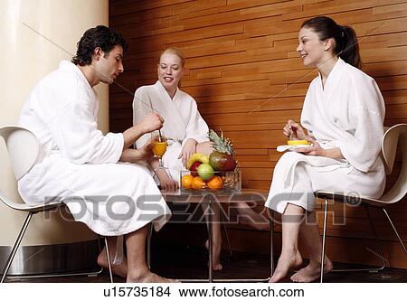 Picture - Friends having a refreshment after a spa treatment. Fotosearch