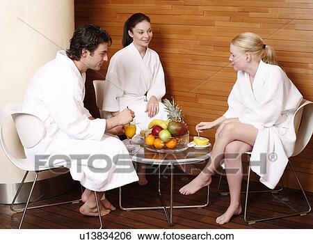Stock Photograph - Friends having a refreshment after a spa treatment. Fotosearch