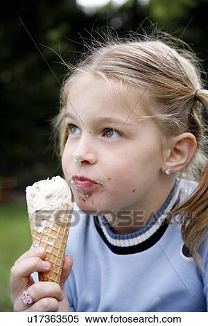 Young girl eating ice cream View Large Photo Image Stock Photography - Young girl eating ice cream . Fotosearch