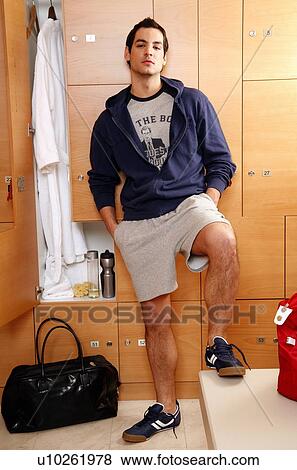 Man in locker room after work out View Large Photo Image Stock Photo - Man in locker room after work out . Fotosearch