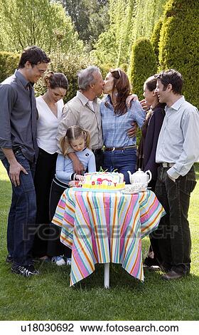 Family celebrating a birthday View Large Photo Image Stock Image - Family celebrating a birthday. Fotosearch