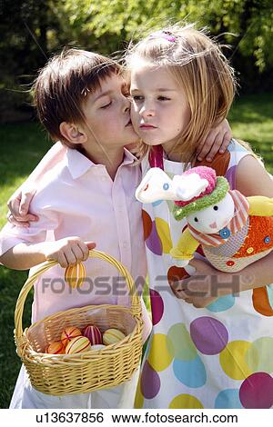 Little boy and girl with Easter egg basket View Large Photo Image Stock Photograph - Little boy and girl with Easter egg basket. Fotosearch