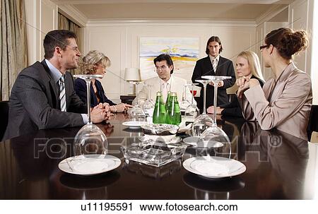 Stock Image - Business people having a meeting . Fotosearch