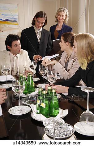 Business people having a meeting View Large Photo Image Stock Photo - Business people having a meeting . Fotosearch