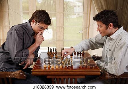 Two men playing chess View Large Photo Image Stock Photo - Two men playing chess. Fotosearch