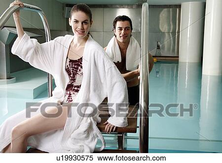 Young couple in a swimming pool at a spa View Large Photo Image Stock Photography - Young couple in a swimming pool at a spa. Fotosearch