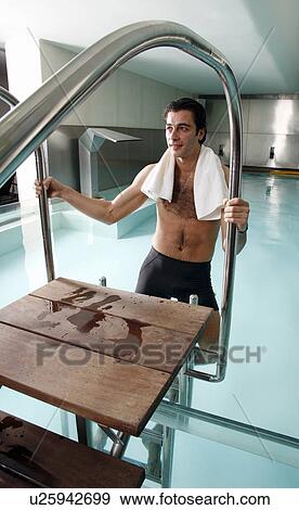 Young man in a swimming pool at a spa View Large Photo Image Stock Photo - Young man in a swimming pool at a spa. Fotosearch