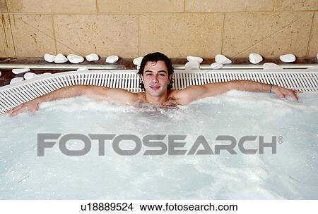 Young man in jacuzzi at a spa View Large Photo Image Picture - Young man in jacuzzi at a spa. Fotosearch
